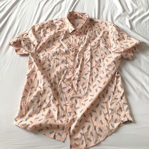 Pineapple print on light pink shirt